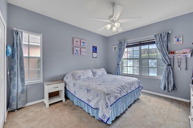 5106 Far Oak Cir, Sarasota, FL 34238 - bedroom featuring baseboards, light carpet, and multiple windows
