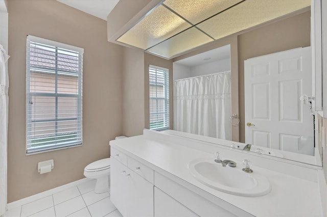 5106 Far Oak Cir, Sarasota, FL 34238 - bathroom with tile patterned floors, vanity, toilet, and a wealth of natural light