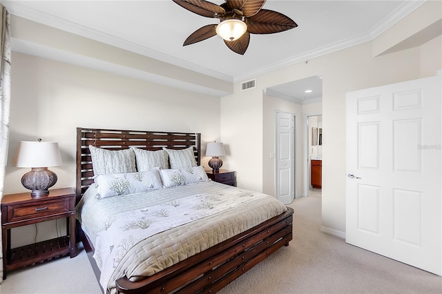 bedroom featuring light carpet, crown molding, baseboards, a ceiling fan, and ensuite bath