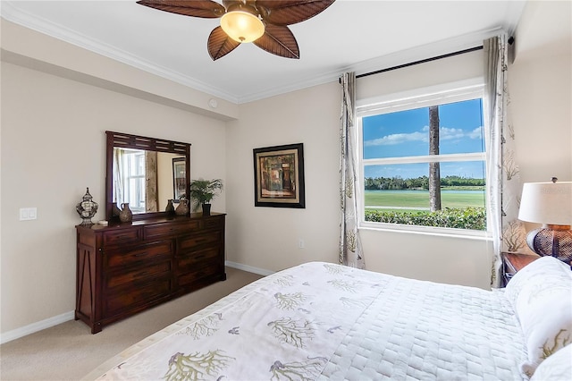 bedroom featuring carpet floors, baseboards, crown molding, and multiple windows