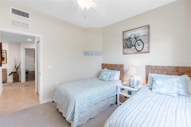 bedroom with baseboards and light tile patterned flooring