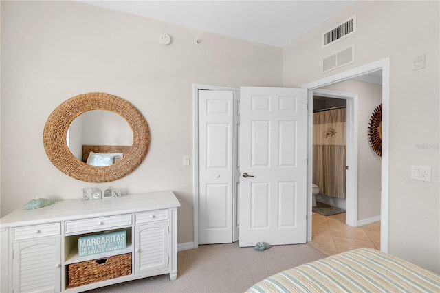 bedroom featuring baseboards and light tile patterned flooring