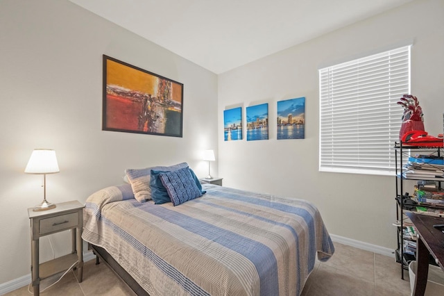 bedroom featuring baseboards