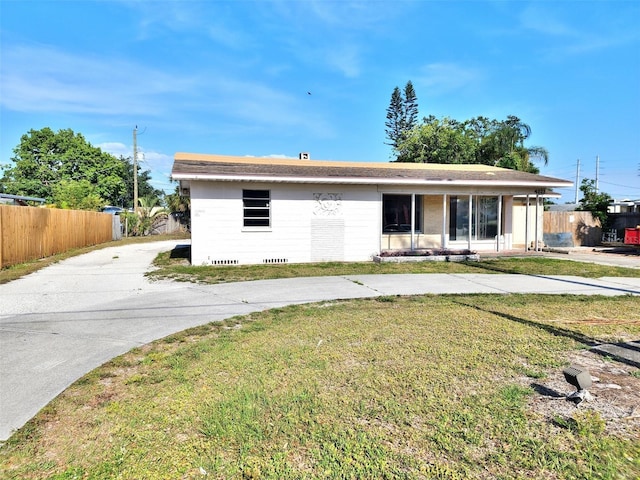 4221 26th St W, Bradenton, FL 34205 - ranch-style home featuring a front lawn, concrete driveway, and fence