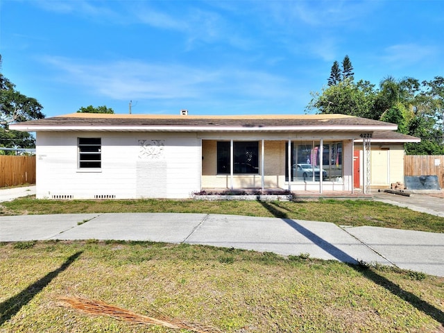 4221 26th St W, Bradenton, FL 34205 - ranch-style house with a front lawn, covered porch, and fence