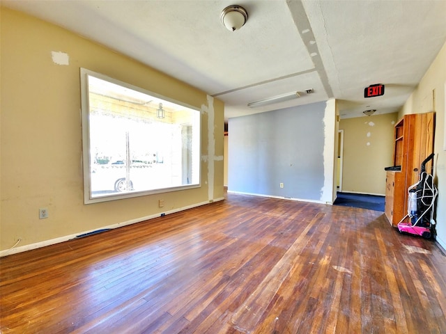 4221 26th St W, Bradenton, FL 34205 - unfurnished living room with hardwood / wood-style floors and baseboards