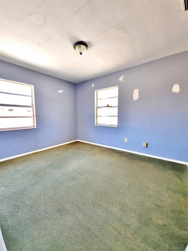 4221 26th St W, Bradenton, FL 34205 - carpeted empty room with baseboards and a textured ceiling