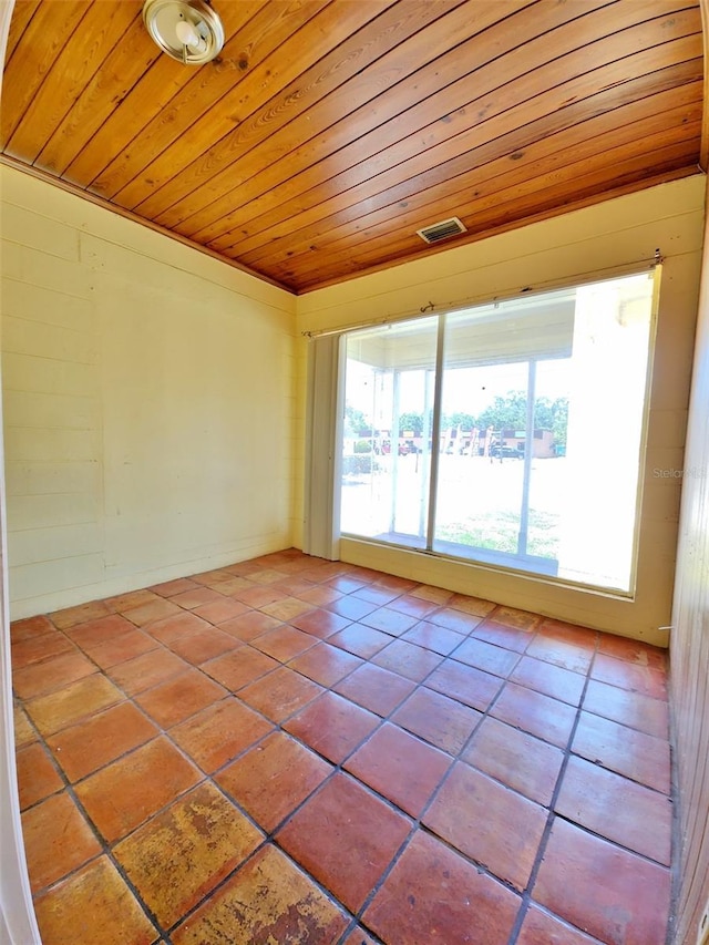 4221 26th St W, Bradenton, FL 34205 - empty room with tile patterned flooring, visible vents, and wood ceiling