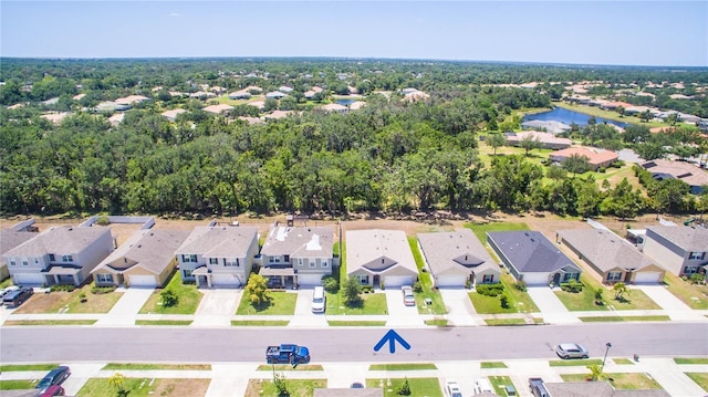 aerial view featuring a water view and a residential view