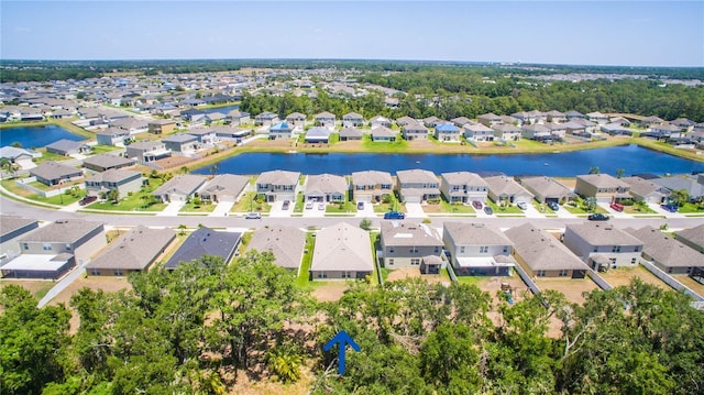 birds eye view of property featuring a water view and a residential view