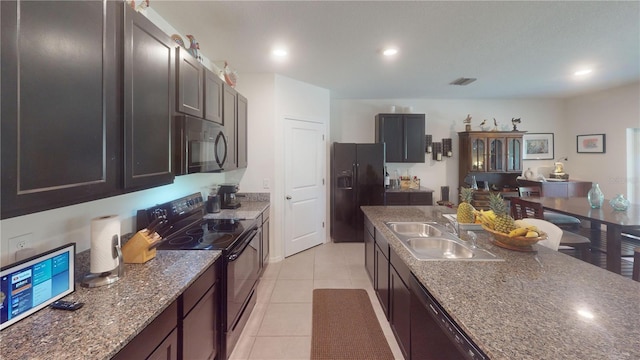 kitchen with visible vents, a sink, black appliances, recessed lighting, and light tile patterned flooring