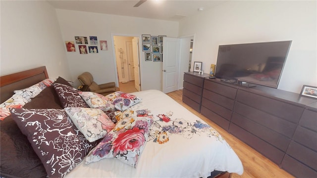 bedroom featuring a ceiling fan and wood finished floors