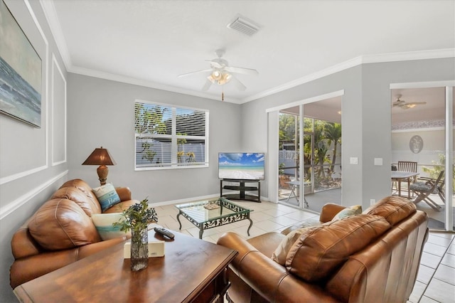 living area featuring light tile patterned floors, ornamental molding, a ceiling fan, and visible vents