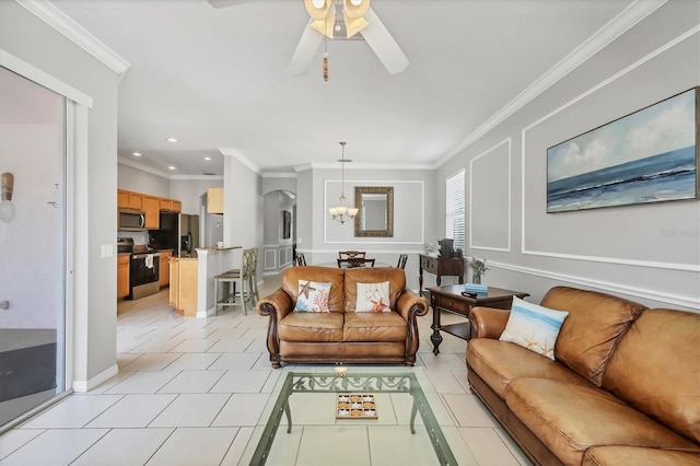 living room with light tile patterned floors, ornamental molding, ceiling fan with notable chandelier, and recessed lighting