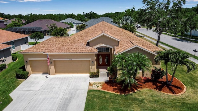 ranch-style home featuring a garage, stucco siding, a front yard, and concrete driveway