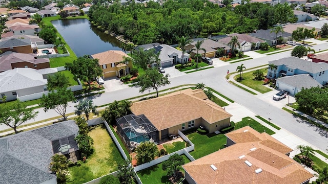 drone / aerial view featuring a water view and a residential view