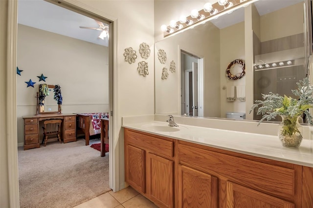 full bathroom featuring toilet, tile patterned flooring, and vanity