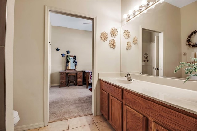 bathroom with tile patterned floors, toilet, and vanity