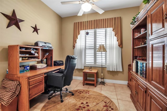 home office with baseboards, light tile patterned floors, and a ceiling fan