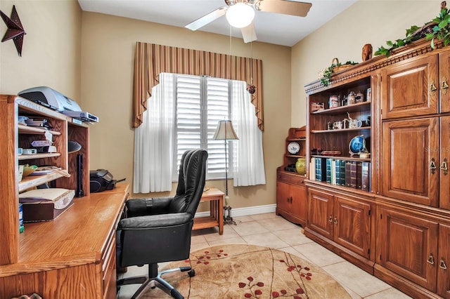 home office with light tile patterned flooring and a ceiling fan