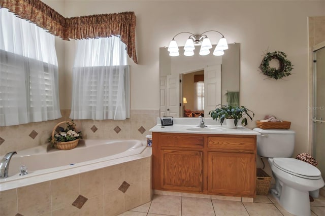 full bath featuring a shower with shower door, tile patterned floors, toilet, a bath, and vanity