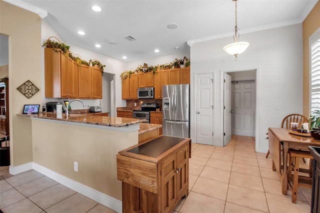 kitchen with light tile patterned floors, visible vents, stainless steel appliances, and a peninsula
