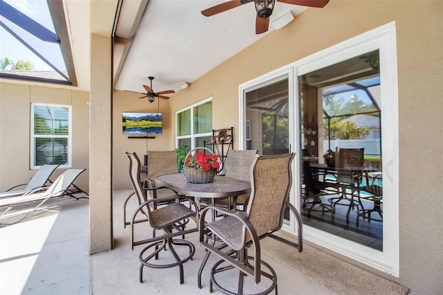 view of patio featuring ceiling fan