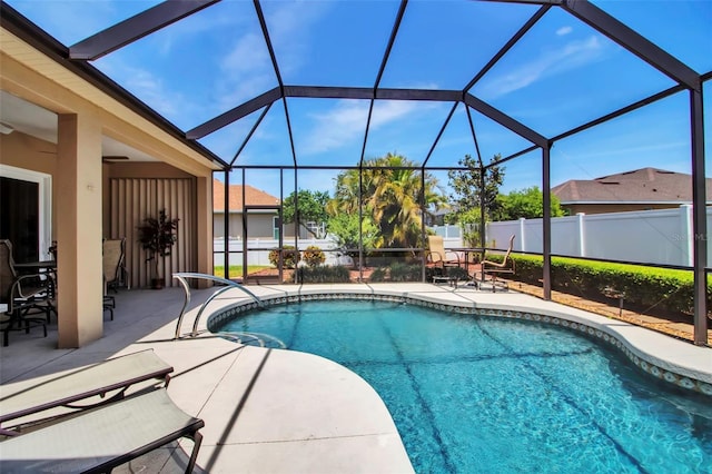 view of pool with fence, a lanai, a patio, and a fenced in pool