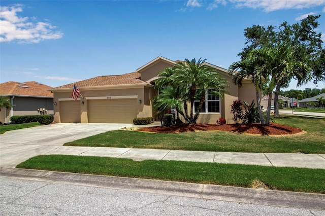 view of front of property with a front yard, concrete driveway, a garage, and stucco siding