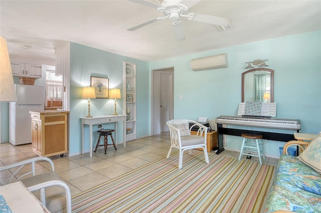 living area with ceiling fan, visible vents, a wall mounted AC, built in shelves, and light tile patterned flooring