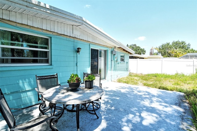 view of patio featuring fence