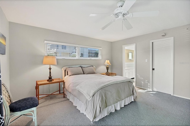 carpeted bedroom featuring baseboards, ceiling fan, and connected bathroom