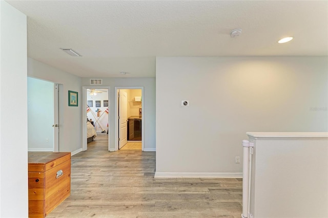 6125 35th Ct E, Bradenton, FL 34203 - hallway featuring recessed lighting, baseboards, visible vents, and light wood-style floors