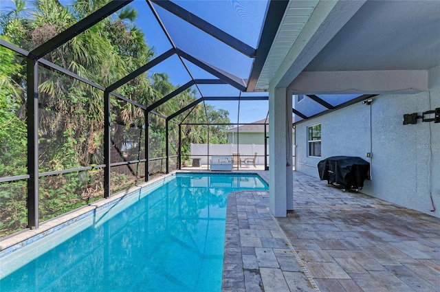 6125 35th Ct E, Bradenton, FL 34203 - view of swimming pool featuring grilling area, a fenced in pool, a patio area, and glass enclosure