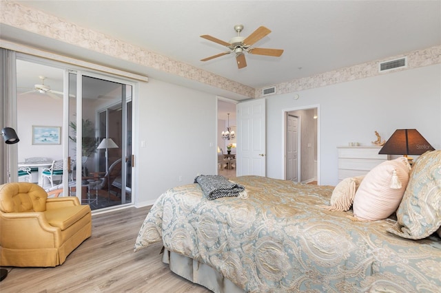 242 Hidden Bay Dr Unit 603, Osprey, FL 34229 - bedroom featuring wood finished floors, access to outside, and a ceiling fan