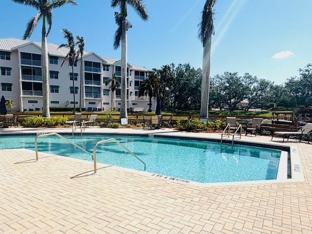 242 Hidden Bay Dr Unit 603, Osprey, FL 34229 - community pool with a patio area