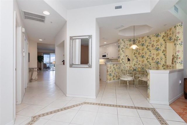 242 Hidden Bay Dr Unit 603, Osprey, FL 34229 - hallway featuring recessed lighting and light tile patterned floors