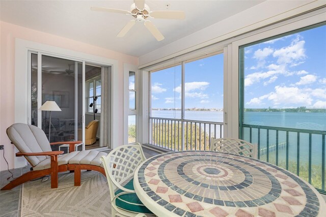 242 Hidden Bay Dr Unit 603, Osprey, FL 34229 - sunroom with a water view and plenty of natural light