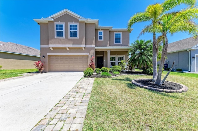 7822 110th Ave E, Parrish, FL 34219 - view of front of property with stucco siding, driveway, a front yard, and an attached garage