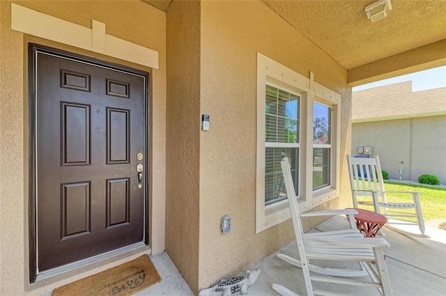 7822 110th Ave E, Parrish, FL 34219 - entrance to property featuring stucco siding and covered porch