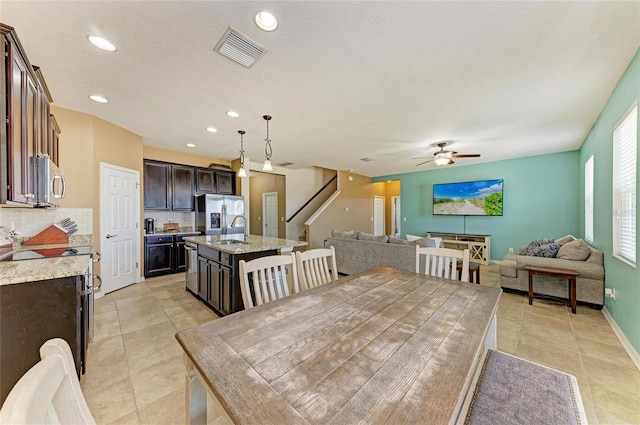 7822 110th Ave E, Parrish, FL 34219 - dining space featuring recessed lighting, stairway, light tile patterned floors, a ceiling fan, and visible vents