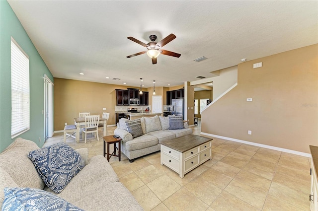 7822 110th Ave E, Parrish, FL 34219 - living room with recessed lighting, light tile patterned floors, a ceiling fan, visible vents, and baseboards