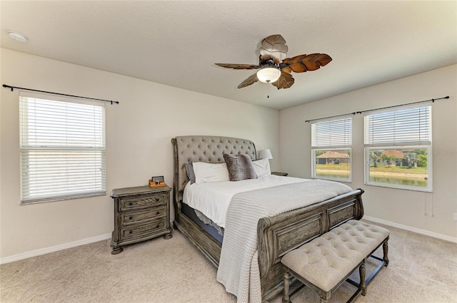 7822 110th Ave E, Parrish, FL 34219 - bedroom featuring ceiling fan, light carpet, and baseboards