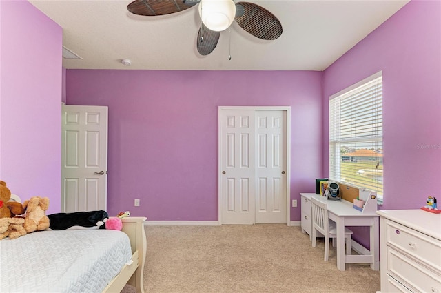 7822 110th Ave E, Parrish, FL 34219 - bedroom with a closet, baseboards, a ceiling fan, and light carpet