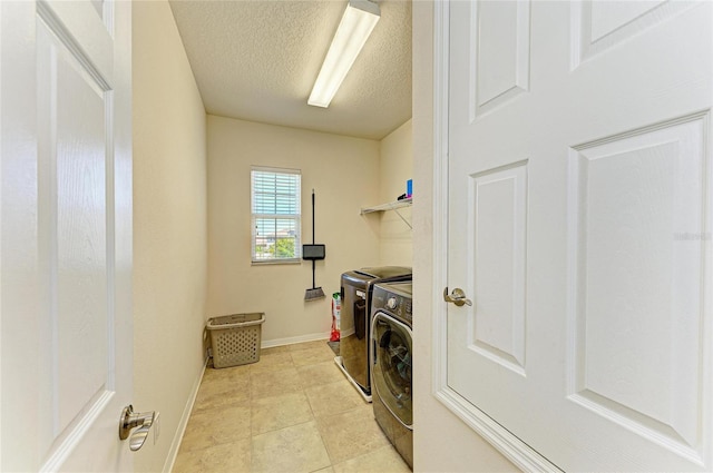 7822 110th Ave E, Parrish, FL 34219 - clothes washing area featuring laundry area, light tile patterned floors, washer and dryer, baseboards, and a textured ceiling