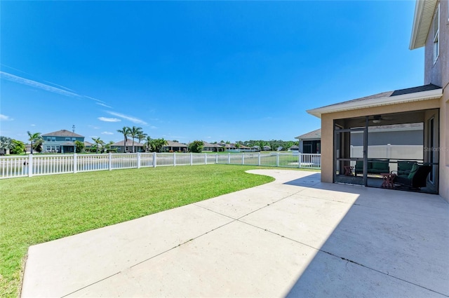 7822 110th Ave E, Parrish, FL 34219 - view of yard with a patio, a sunroom, a water view, a fenced backyard, and a ceiling fan
