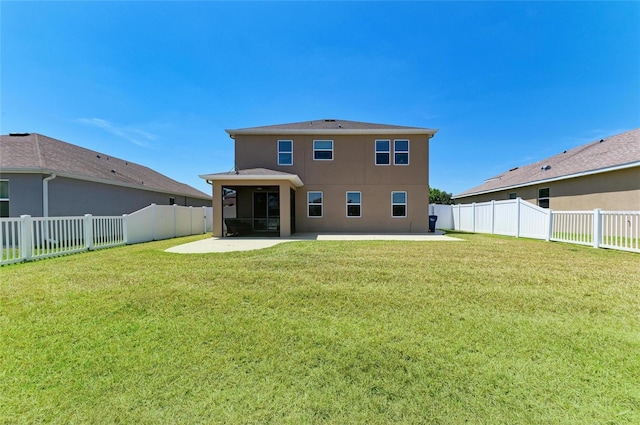 7822 110th Ave E, Parrish, FL 34219 - rear view of house with stucco siding, a yard, a patio, and a fenced backyard