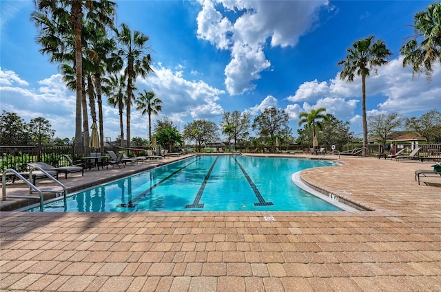 7822 110th Ave E, Parrish, FL 34219 - community pool featuring a patio and fence