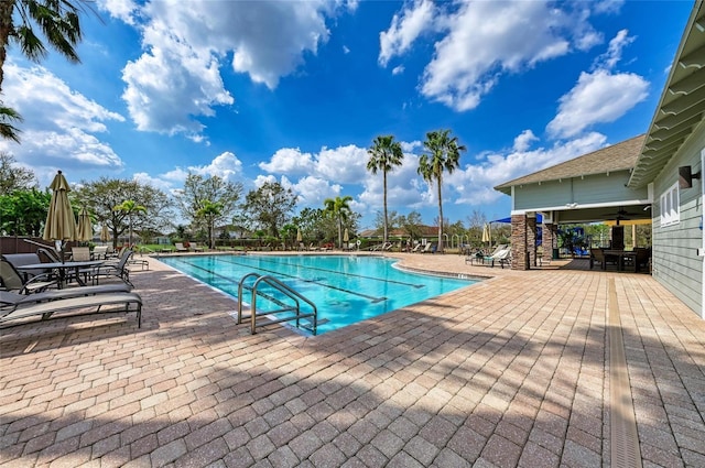 7822 110th Ave E, Parrish, FL 34219 - community pool with a patio and a ceiling fan