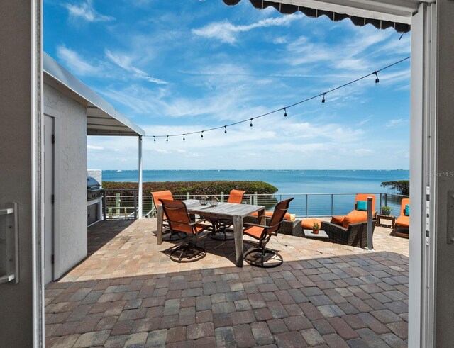 2282 Harbour Court Dr, Longboat Key, FL 34228 - view of patio featuring outdoor dining area and a water view
